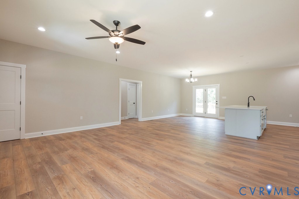 5200 Three Chopt Road Louisa, VA 23093 - Photo 14 of 47 a view of an empty room with window and wooden floor