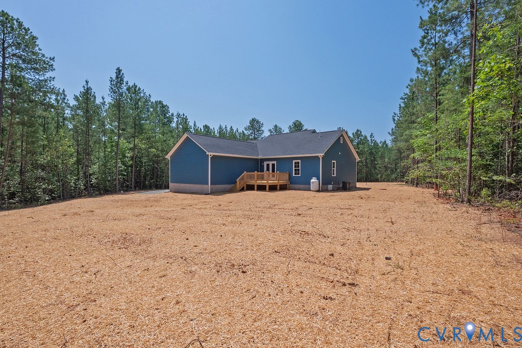 5200 Three Chopt Road Louisa, VA 23093 - Photo 36 of 47 a front view of a house with a yard and garage