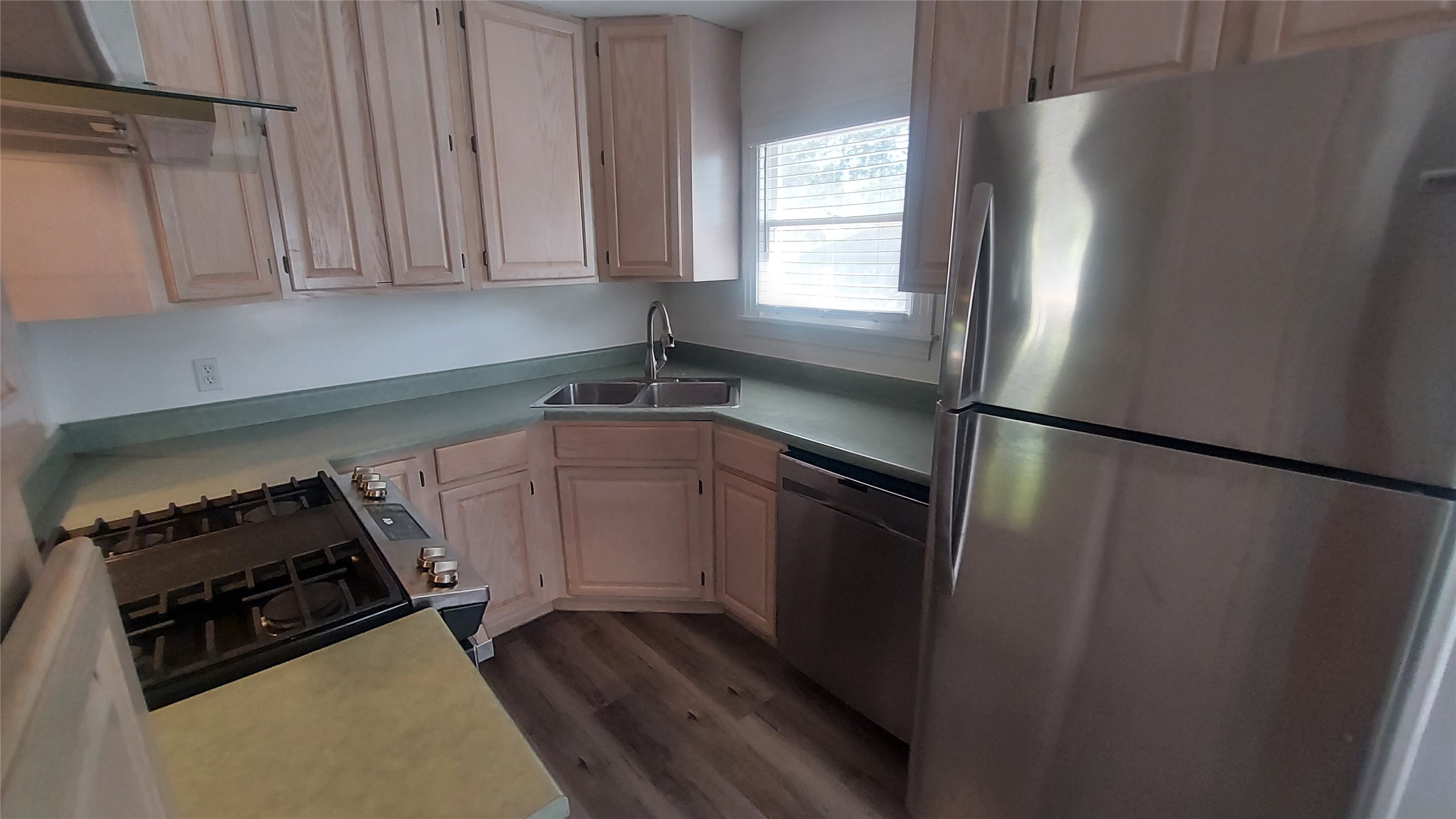 1411 Ruth Avenue Austin, TX 78757 - Photo 16 of 26 EFFICIENT KITCHEN WITH GAS COOKING, REFRIGERATOR, DISHWASHER AND DISPOSAL