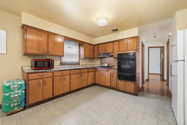 a bedroom with bunk bed and a window