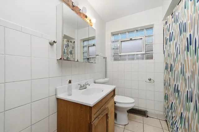 a view of a patio with table and chairs with wooden floor