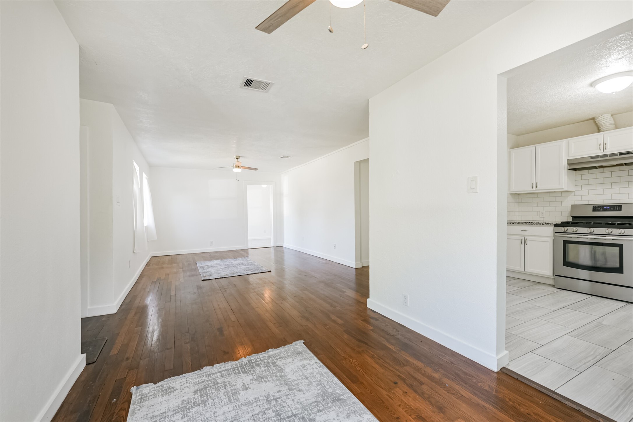 7546 Greendowns Street Houston, TX 77087 - Photo 17 of 33 a view of a kitchen cabinets and wooden floor