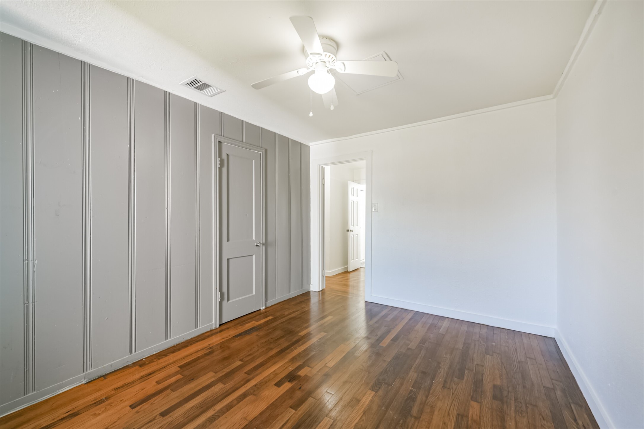 7546 Greendowns Street Houston, TX 77087 - Photo 25 of 33 a view of a room with wooden floor