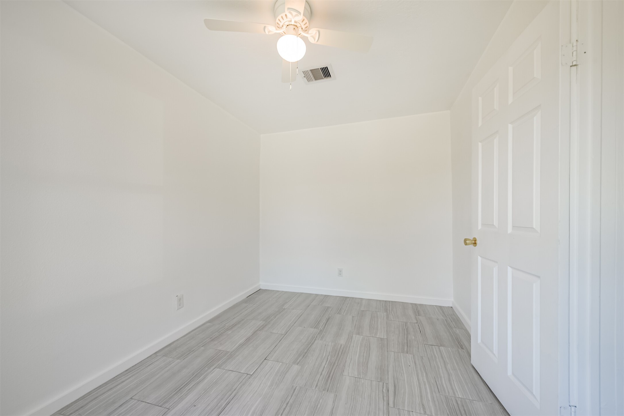 7546 Greendowns Street Houston, TX 77087 - Photo 33 of 33 a view of a hallway with wooden floor