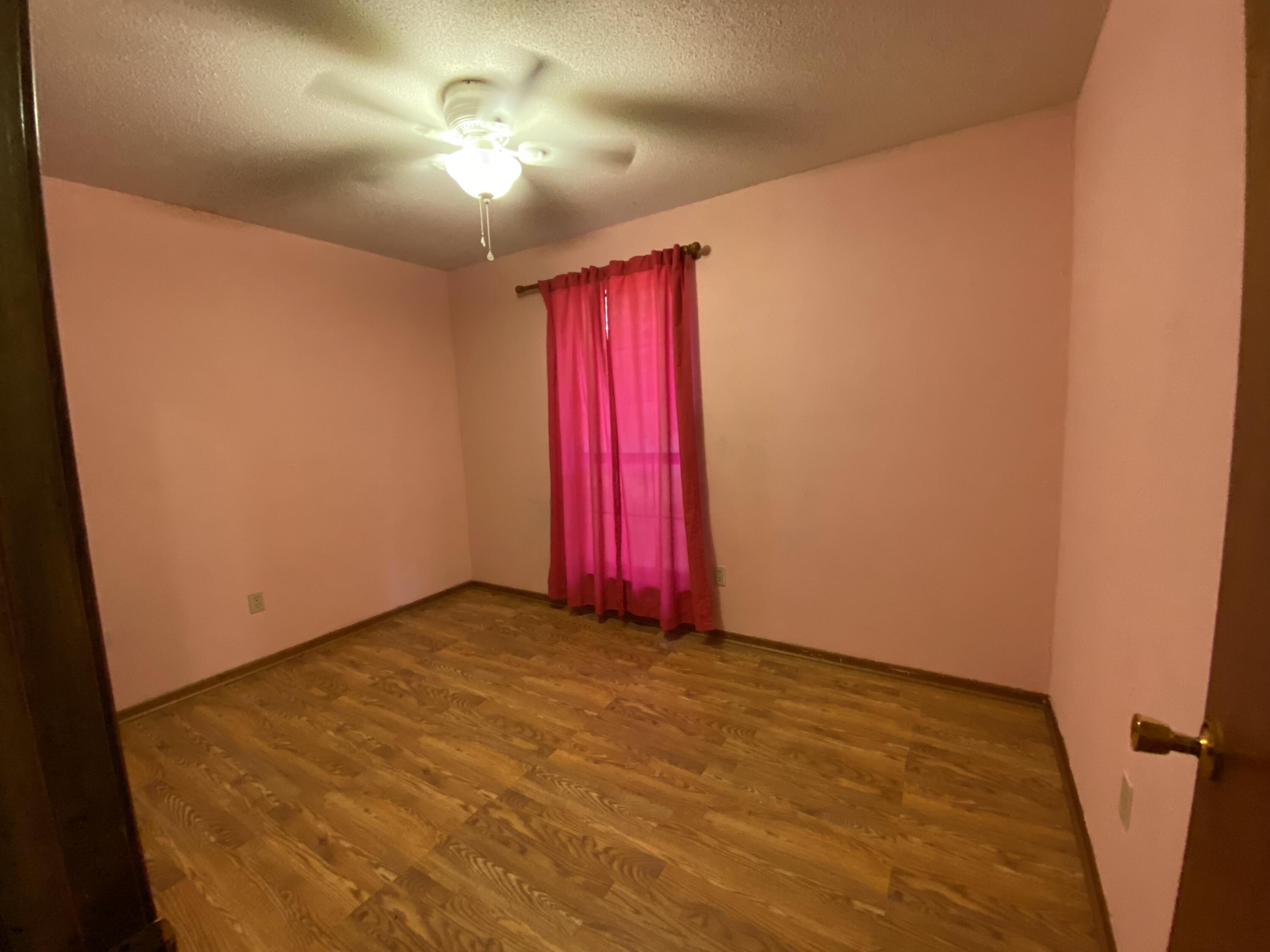 3170 Skyline Drive Crestview, FL 32539 - Photo 12 of 16 a view of a room with window and carpet