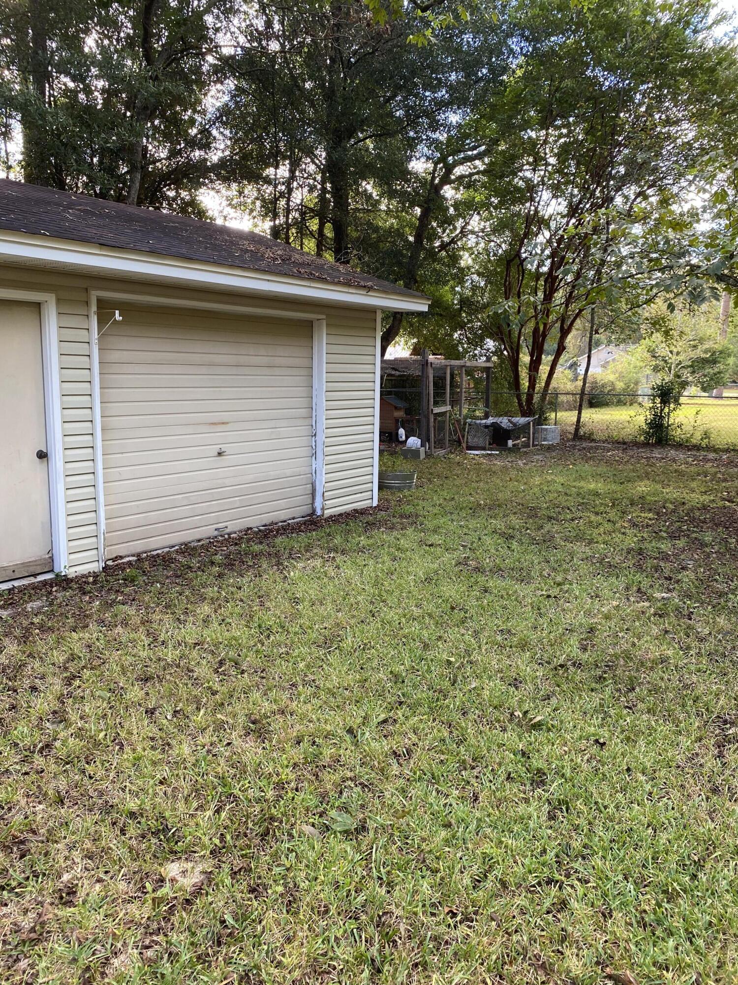 3170 Skyline Drive Crestview, FL 32539 - Photo 16 of 16 a view of a backyard with large trees