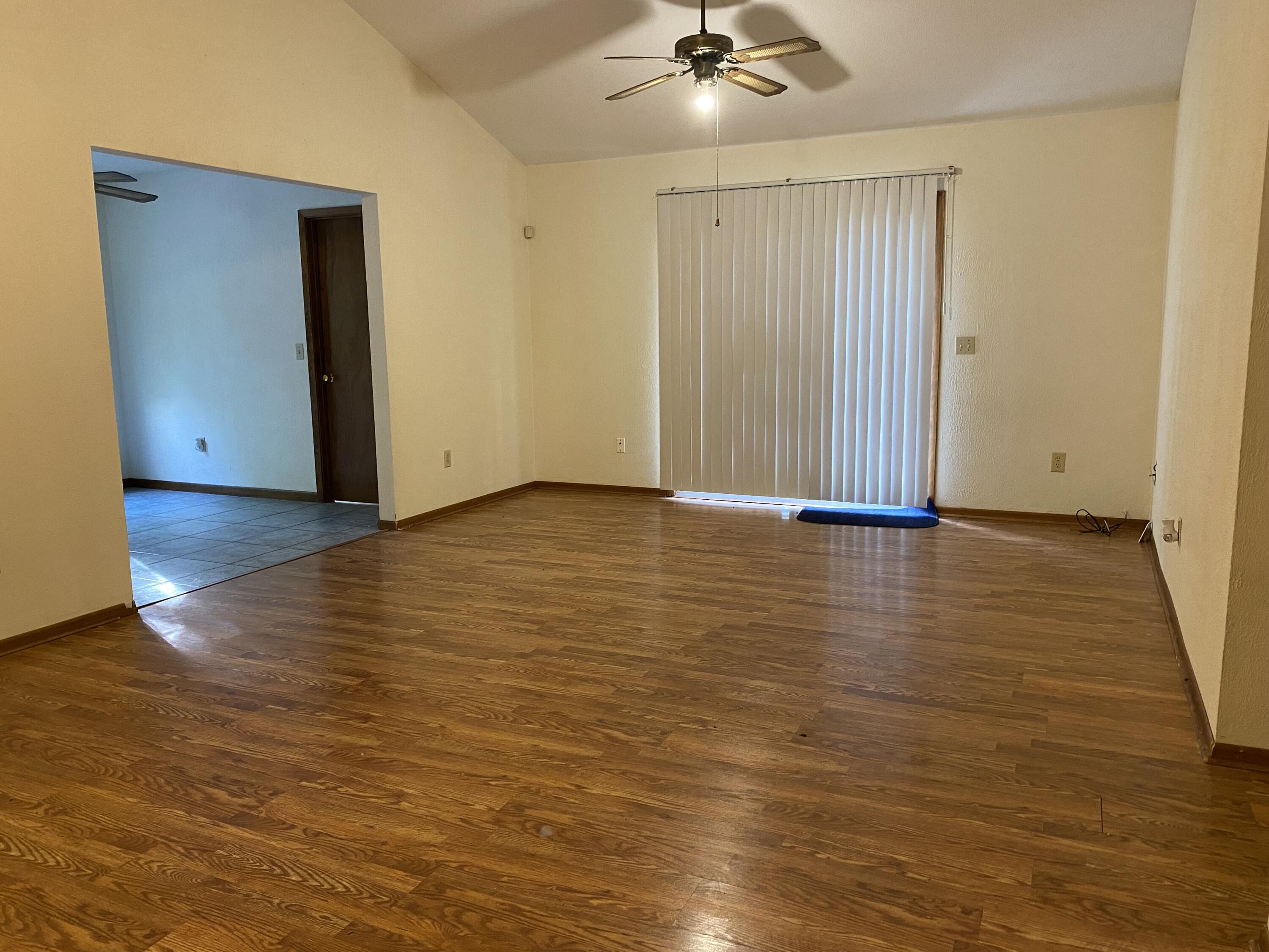 3170 Skyline Drive Crestview, FL 32539 - Photo 2 of 16 a view of an empty room with wooden floor