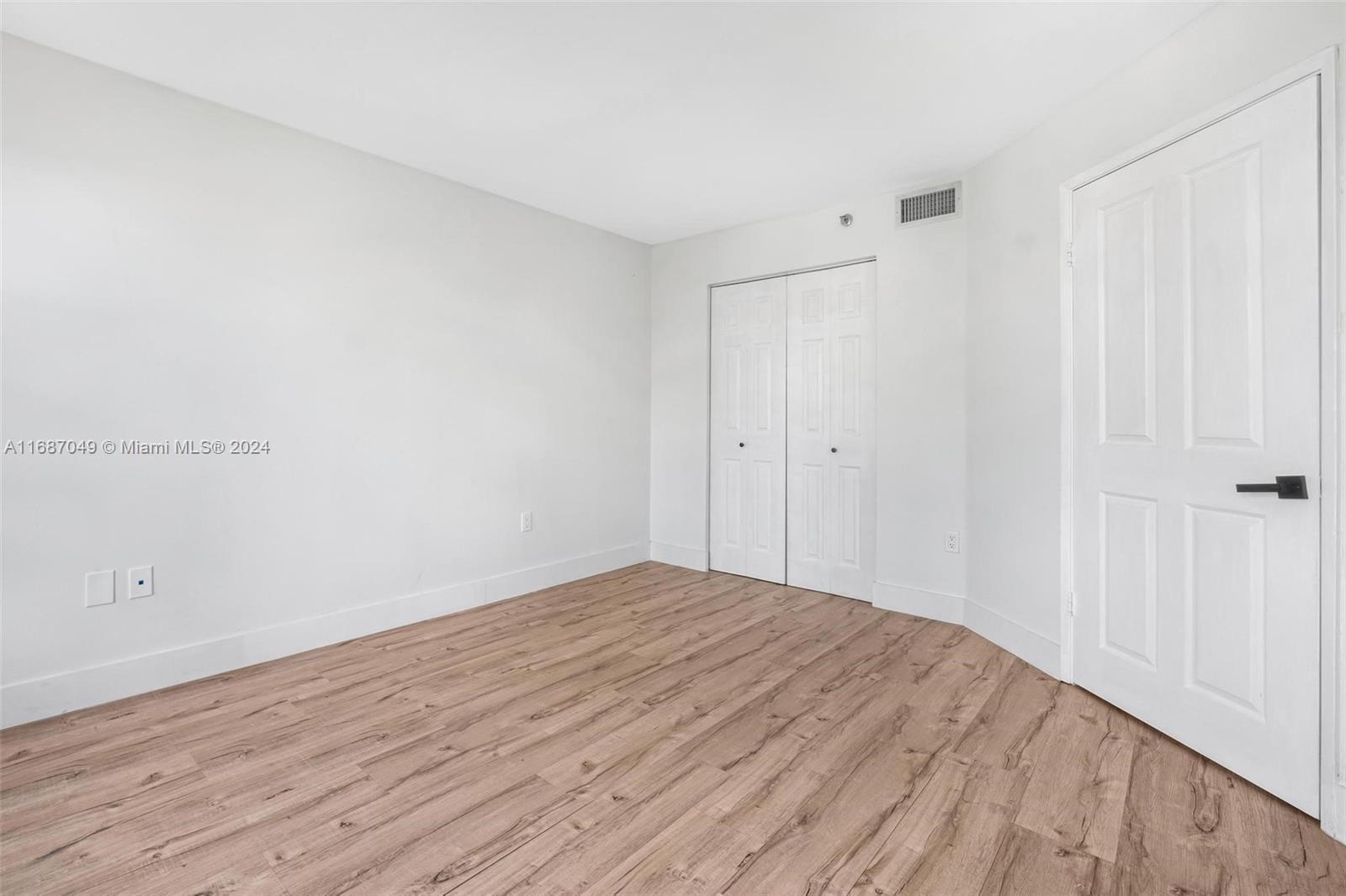 2351 Douglas Road, Unit 504 Miami, FL 33145 - Photo 18 of 41 a view of empty room with wooden floor