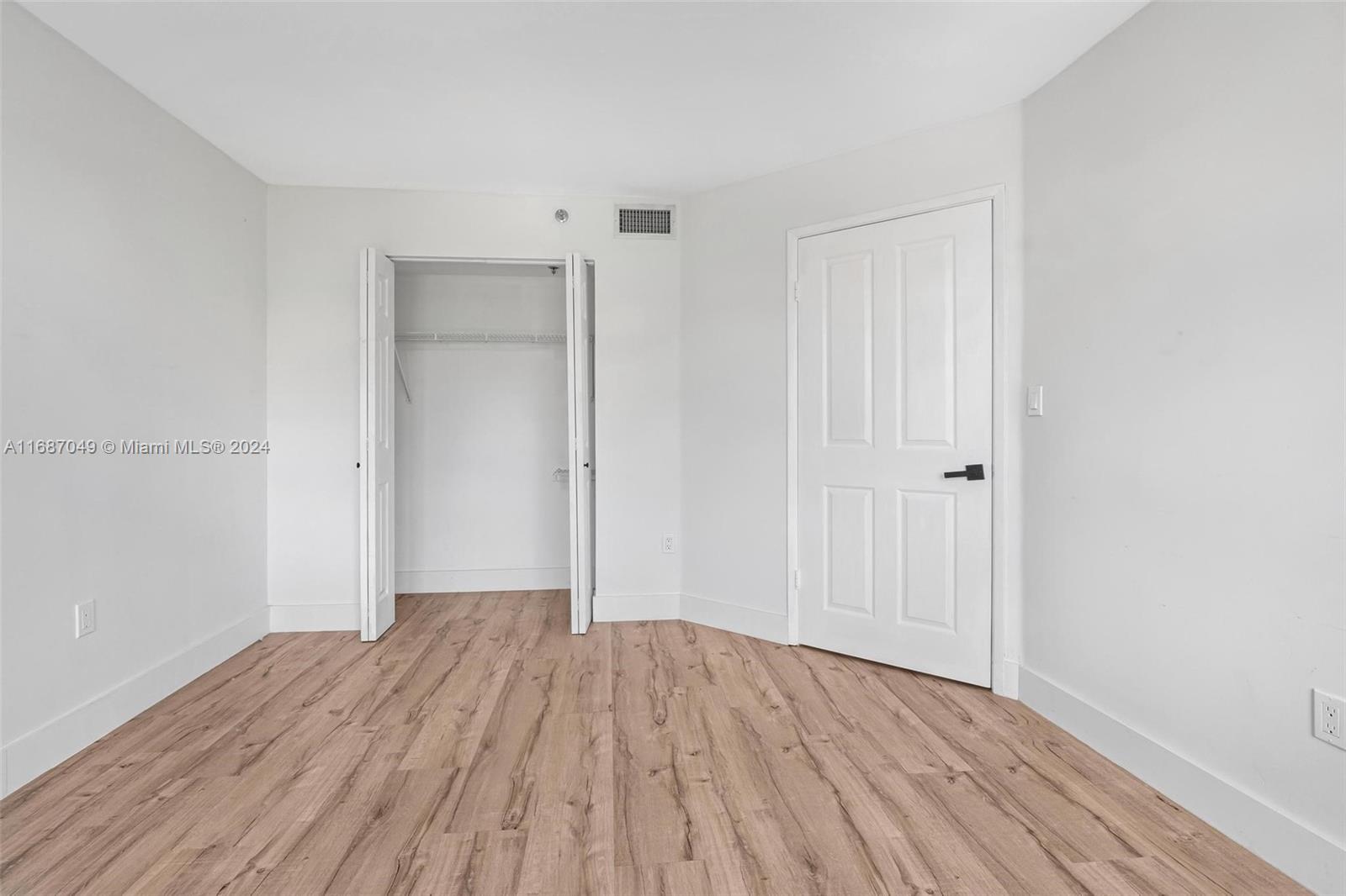 2351 Douglas Road, Unit 504 Miami, FL 33145 - Photo 21 of 41 a view of a room with wooden floor