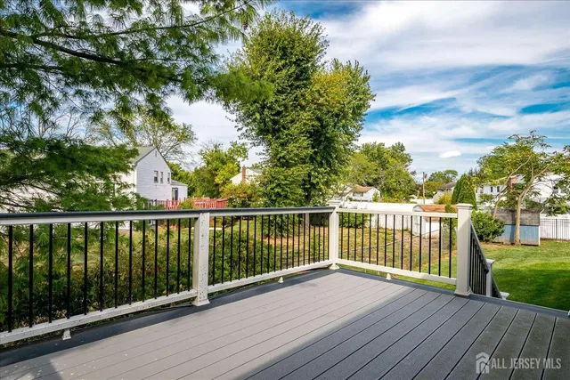 a view of balcony with wooden floor and fence
