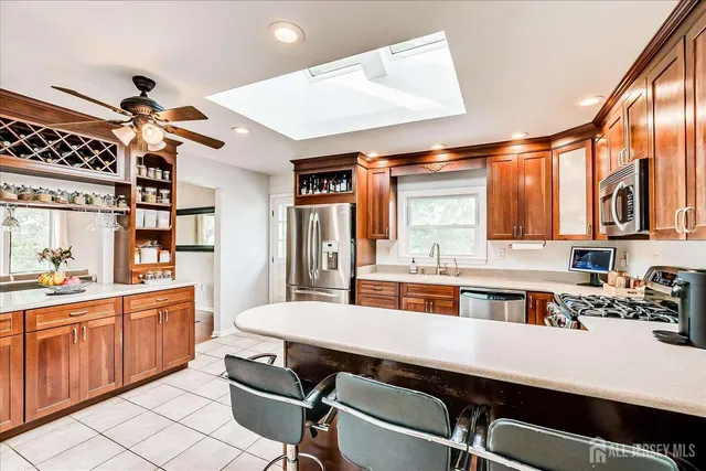 a large kitchen with a table and chairs