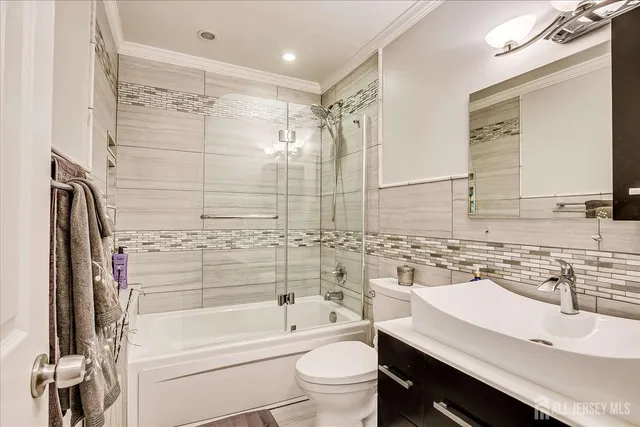 a bathroom with a sink a toilet and a bathtub