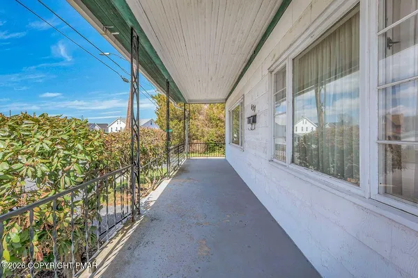 a view of a glass door with a balcony