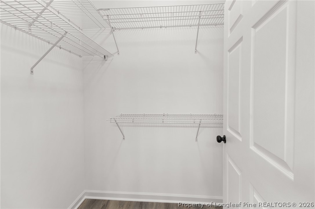 802 Holmes Street Clinton, NC 28328 - Photo 18 of 31 a view of a room with racks on the wall