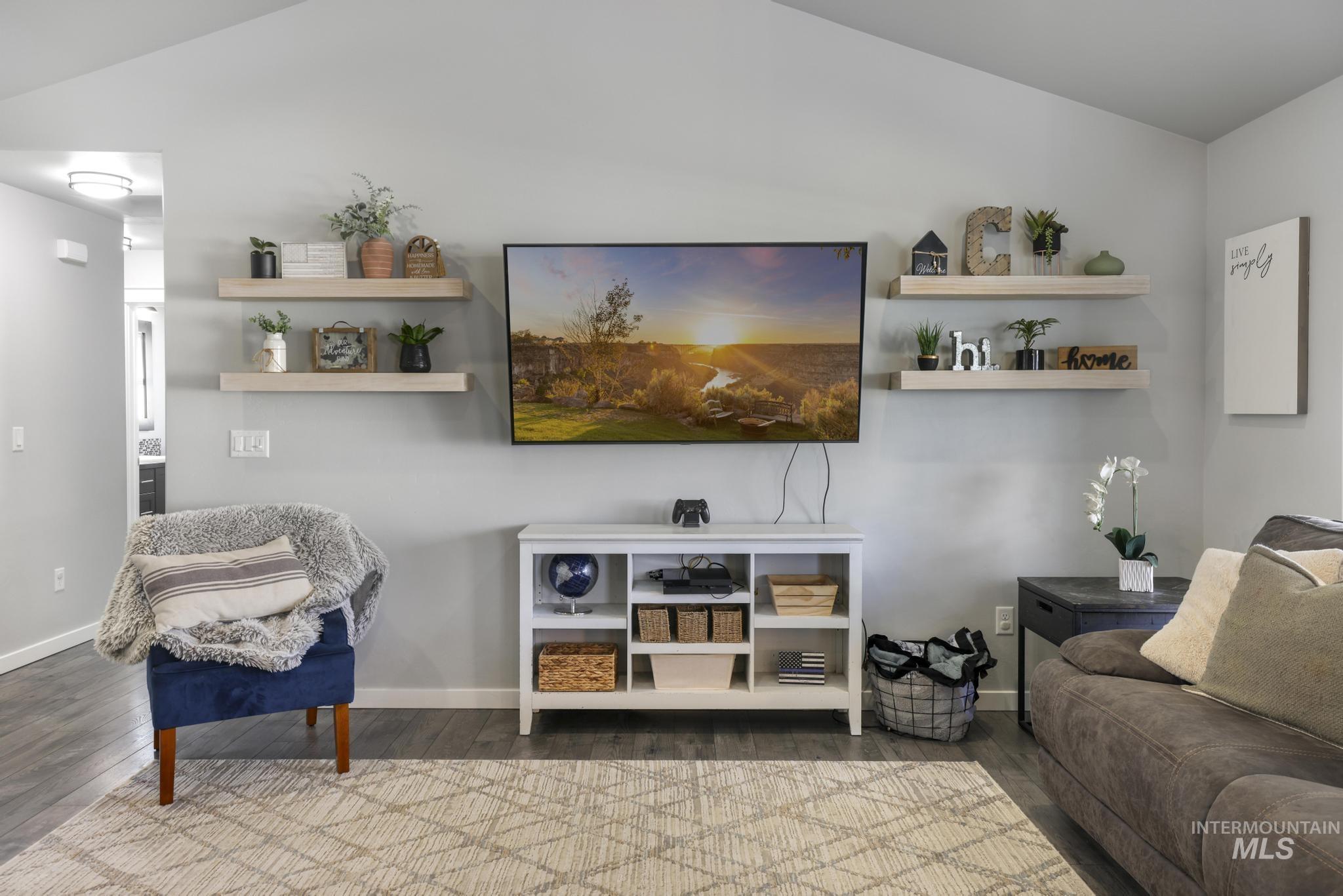 2396 Village Street Twin Falls, ID 83301 - Photo 11 of 44 Living area featuring wood finished floors and lofted ceiling