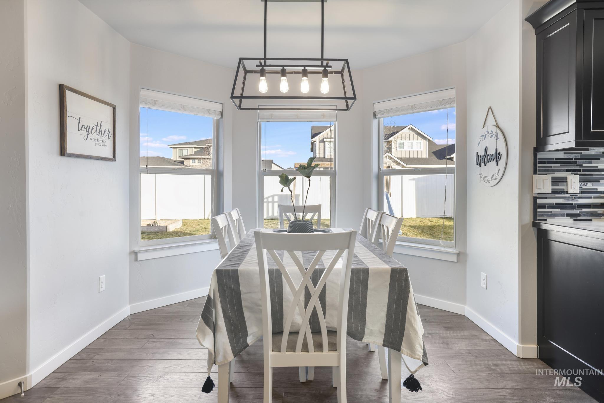 2396 Village Street Twin Falls, ID 83301 - Photo 17 of 44 Dining space with dark wood-style floors and plenty of natural light