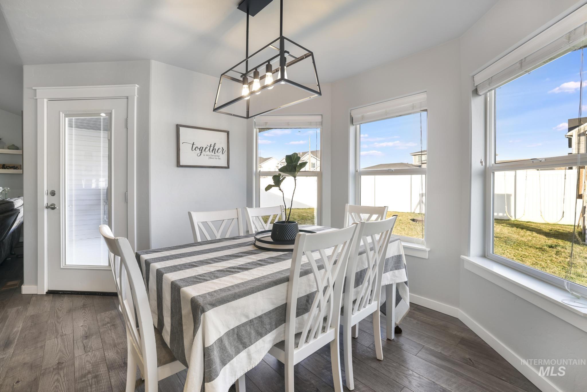 2396 Village Street Twin Falls, ID 83301 - Photo 18 of 44 Dining area with dark wood-style flooring and plenty of natural light