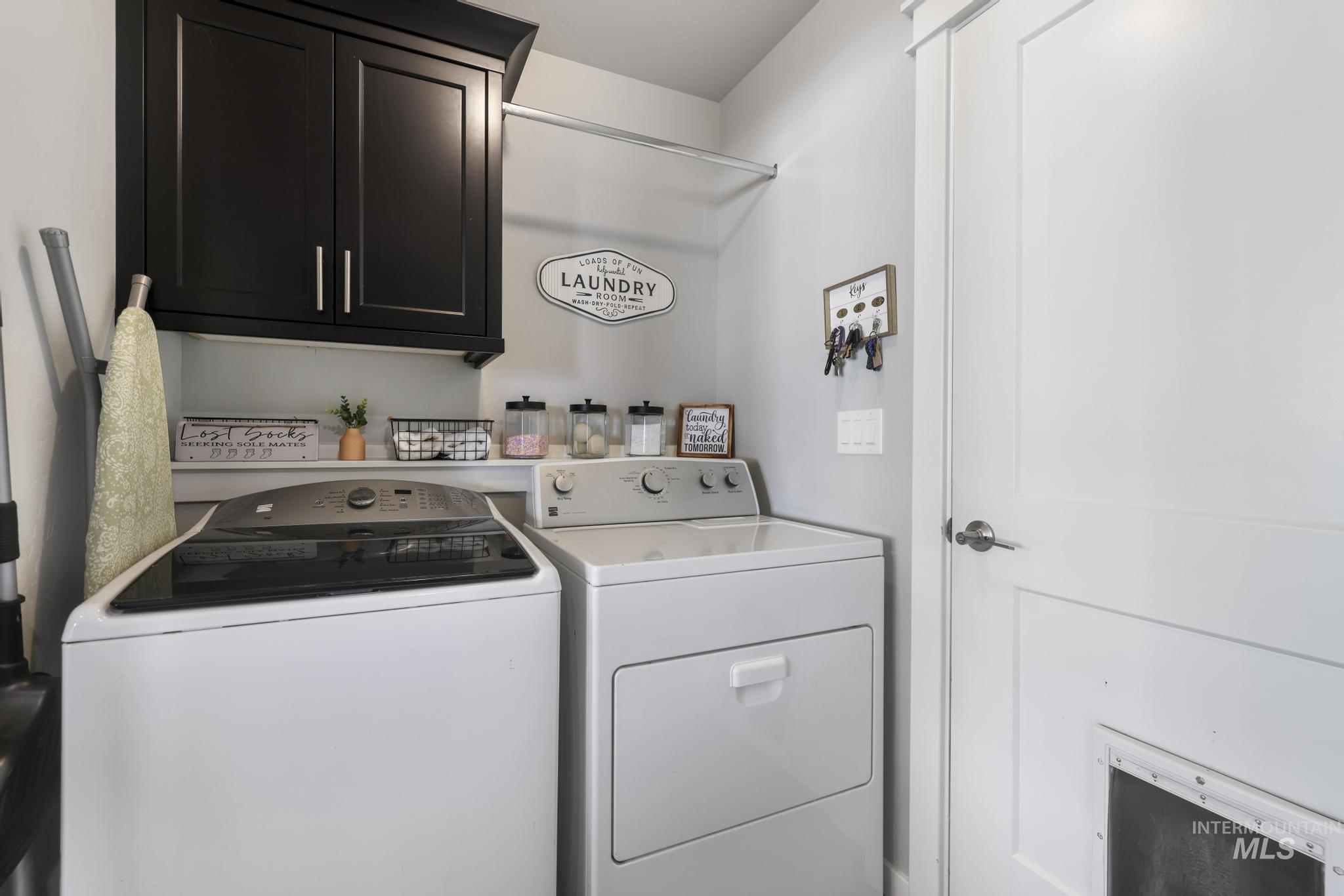 2396 Village Street Twin Falls, ID 83301 - Photo 24 of 44 Laundry room with cabinet space and washing machine and dryer