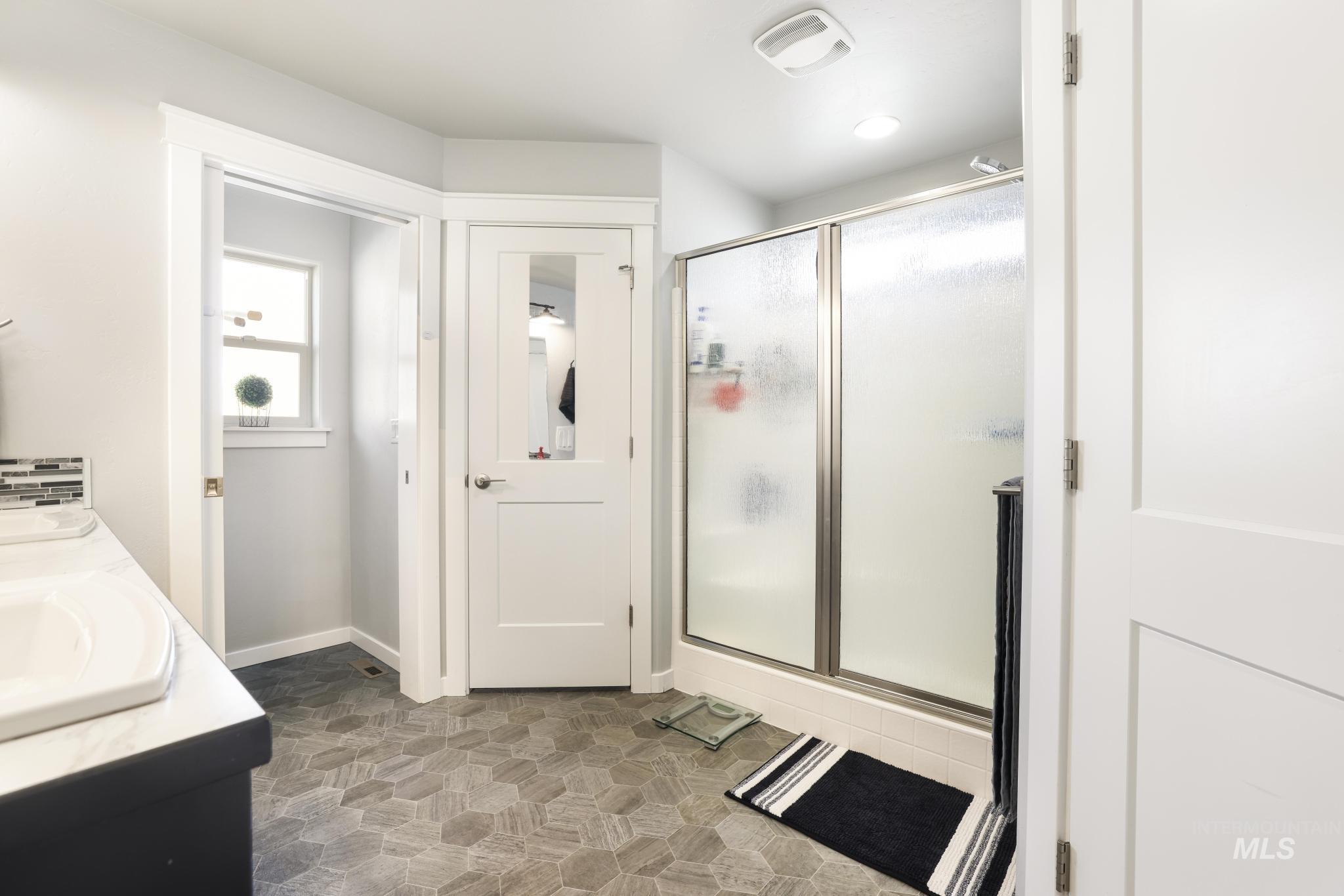 2396 Village Street Twin Falls, ID 83301 - Photo 28 of 44 Bathroom featuring double vanity and a stall shower
