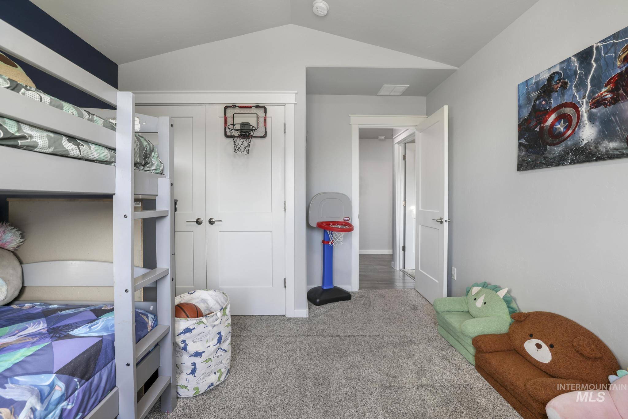 2396 Village Street Twin Falls, ID 83301 - Photo 31 of 44 Bedroom with a closet, carpet floors, and vaulted ceiling