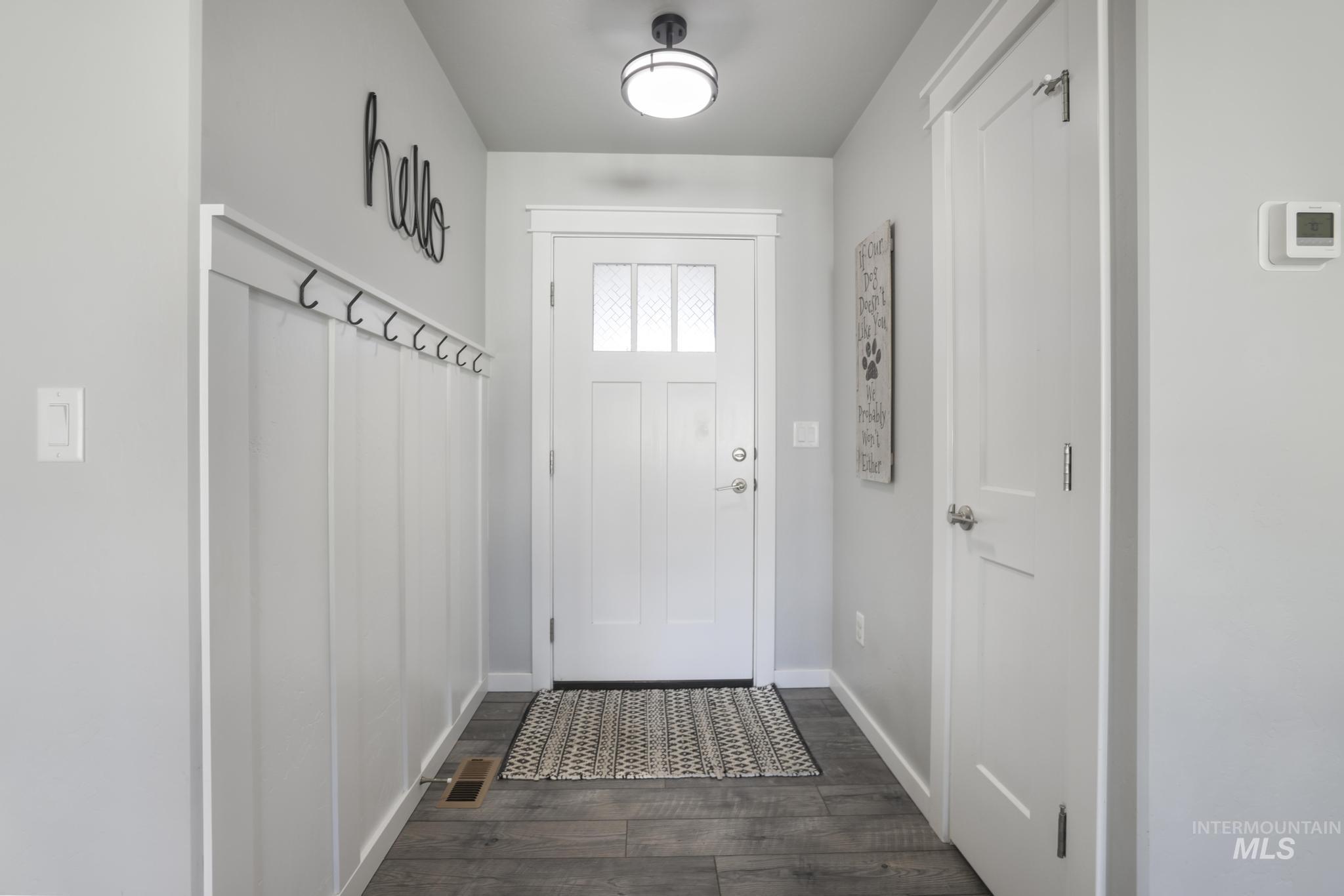 2396 Village Street Twin Falls, ID 83301 - Photo 7 of 44 Entryway with baseboards and wood finished floors