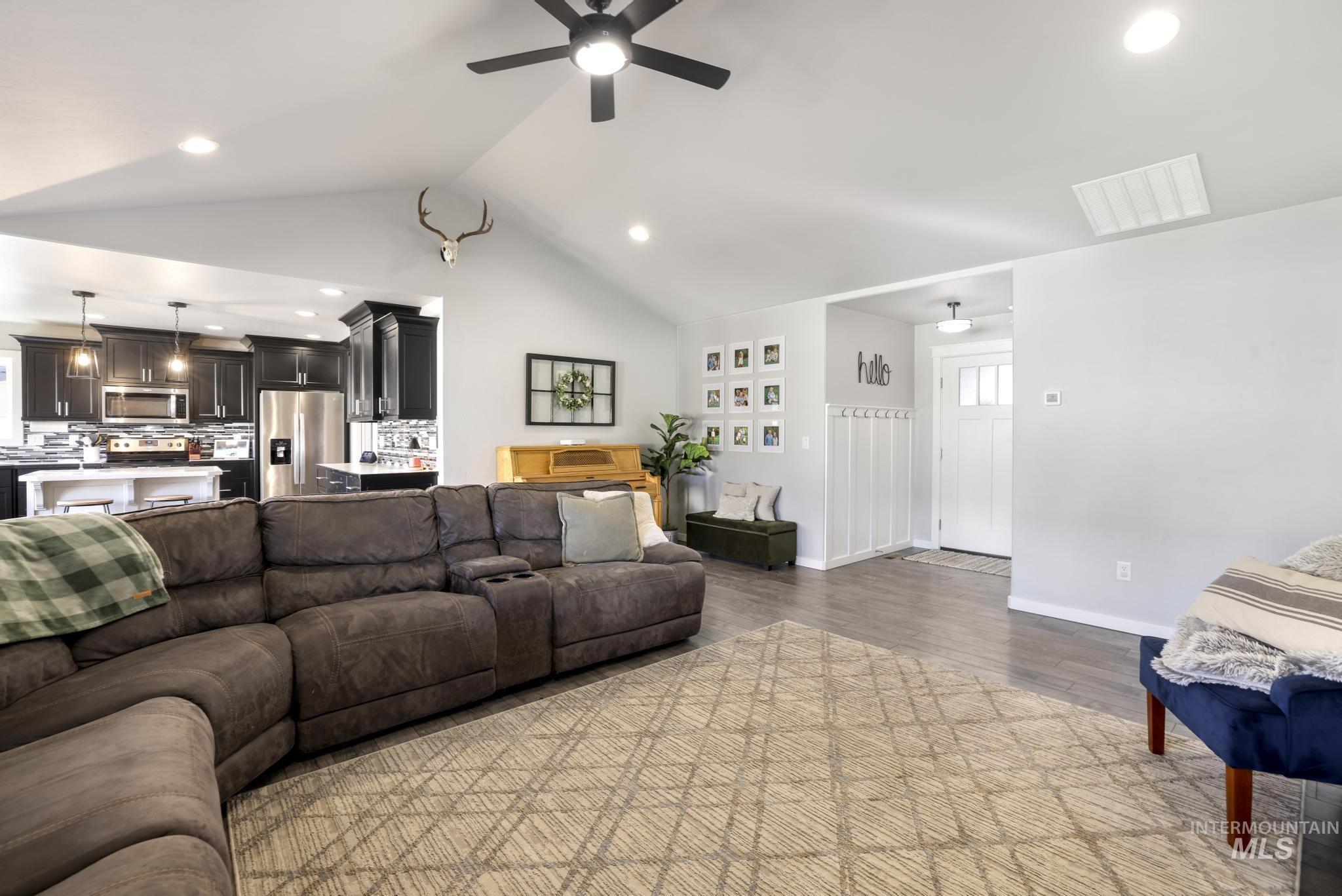 2396 Village Street Twin Falls, ID 83301 - Photo 8 of 44 Living room with recessed lighting, light wood finished floors, vaulted ceiling, and ceiling fan