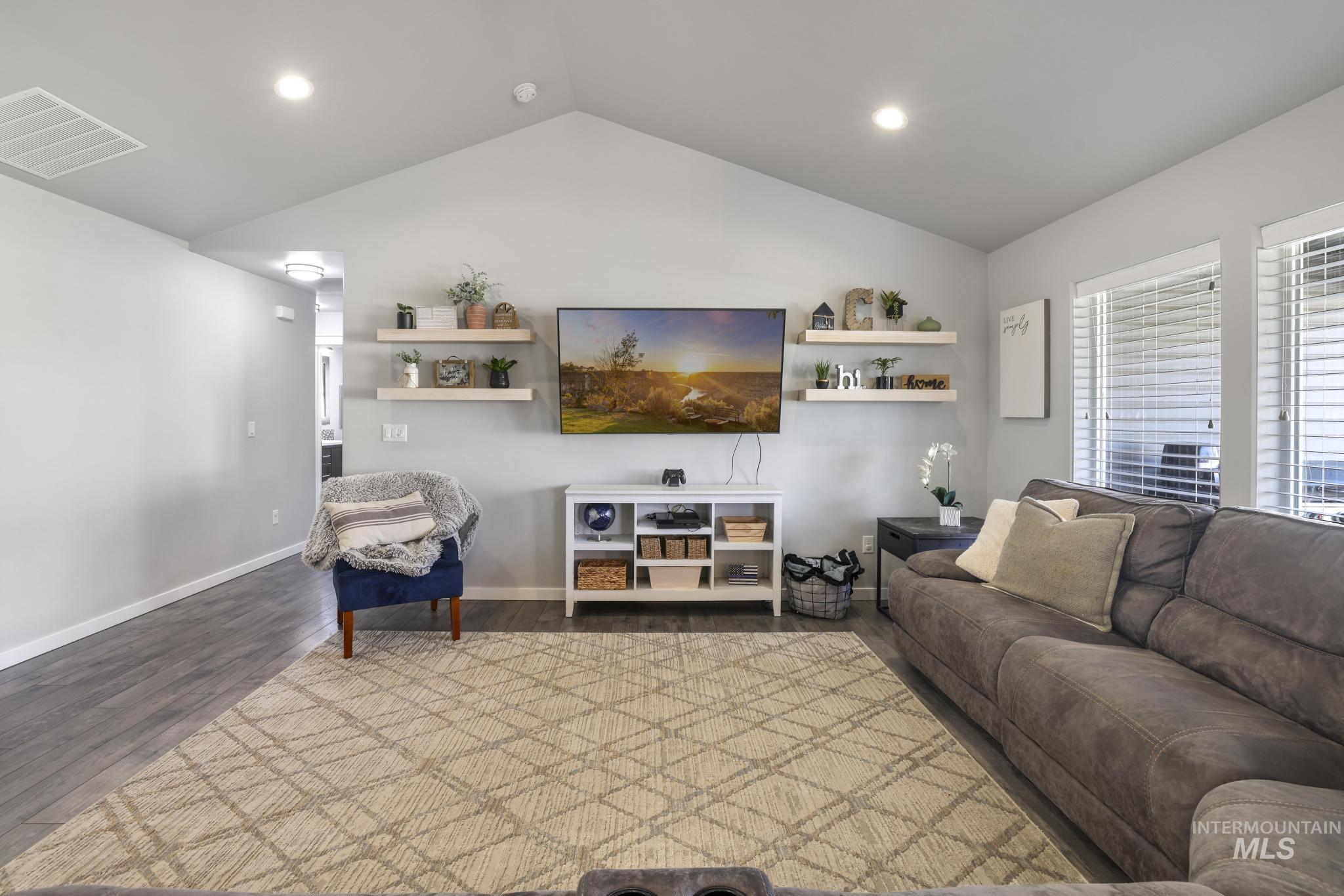 2396 Village Street Twin Falls, ID 83301 - Photo 9 of 44 Living area featuring wood finished floors, lofted ceiling, and recessed lighting