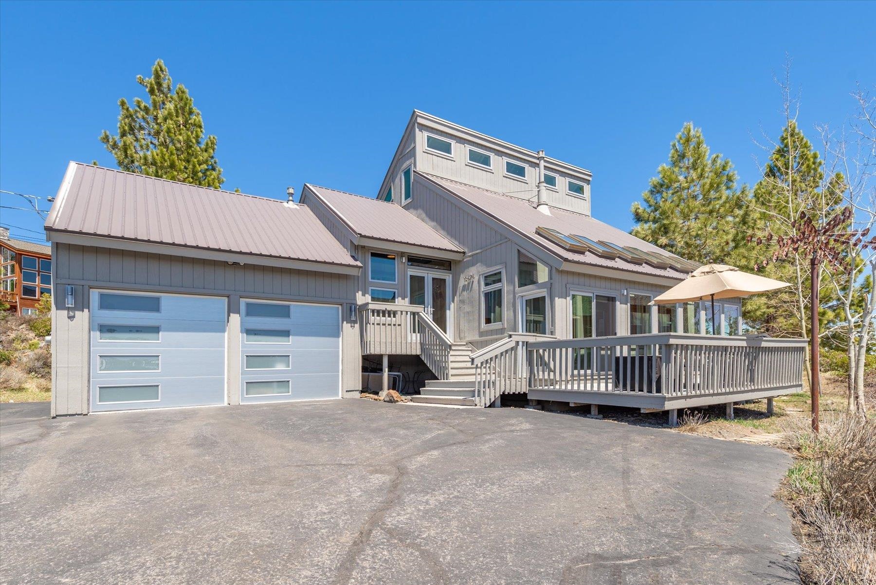 12676 Pinnacle Loop Truckee, CA 96161 - Photo 1 of 19 a front view of a house with a garage