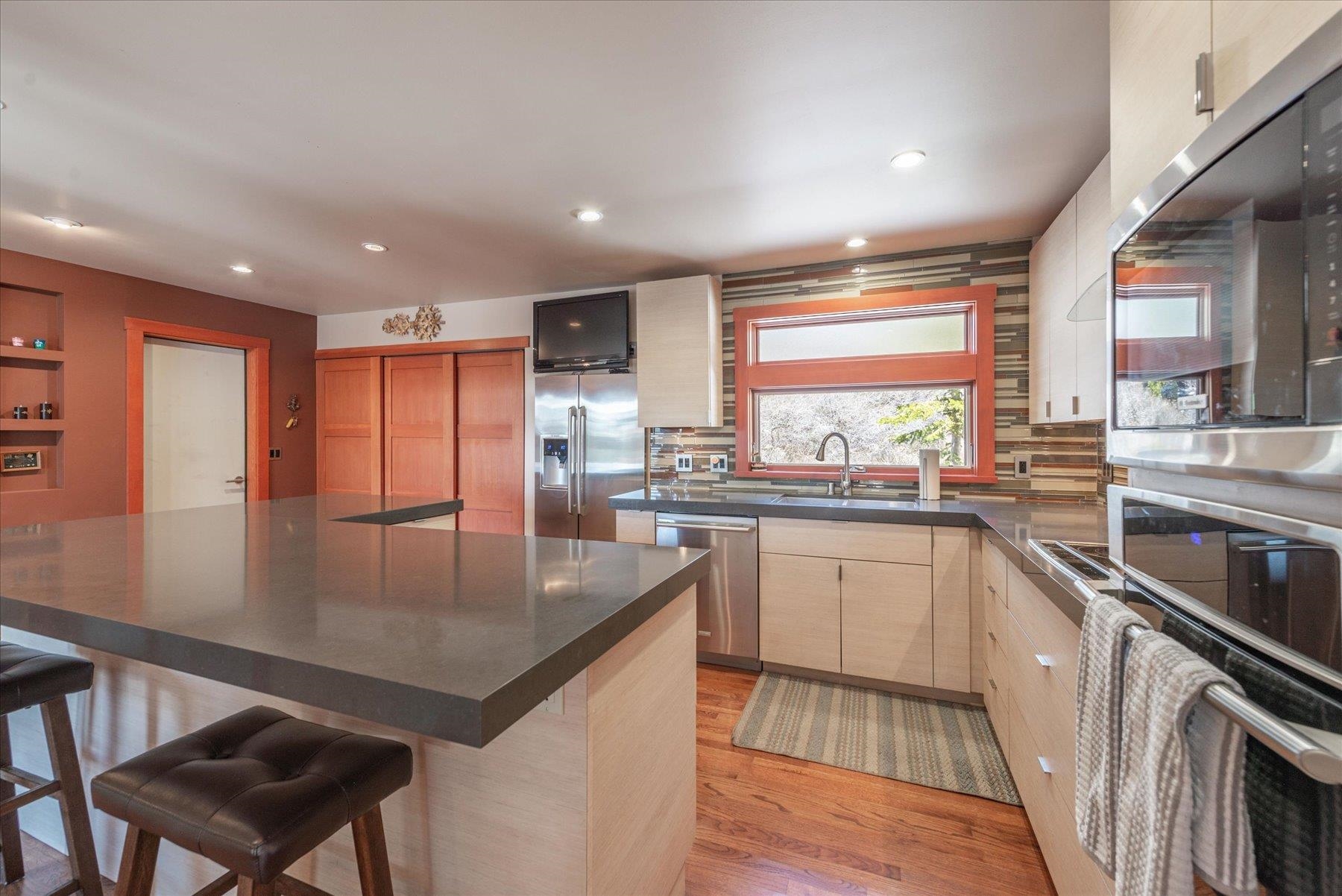12676 Pinnacle Loop Truckee, CA 96161 - Photo 11 of 19 a kitchen with stainless steel appliances granite countertop a sink stove and refrigerator