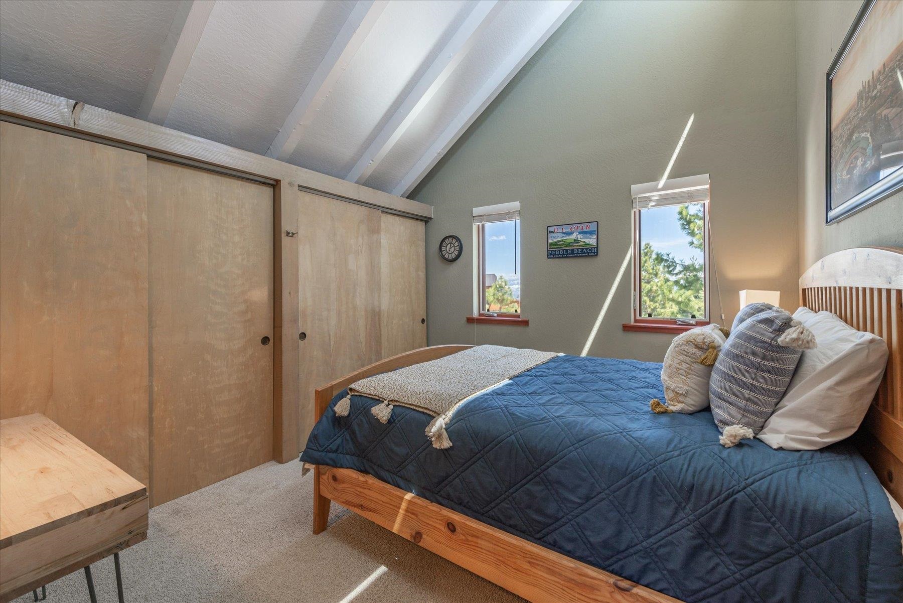 12676 Pinnacle Loop Truckee, CA 96161 - Photo 17 of 19 a bedroom with a large bed and a window