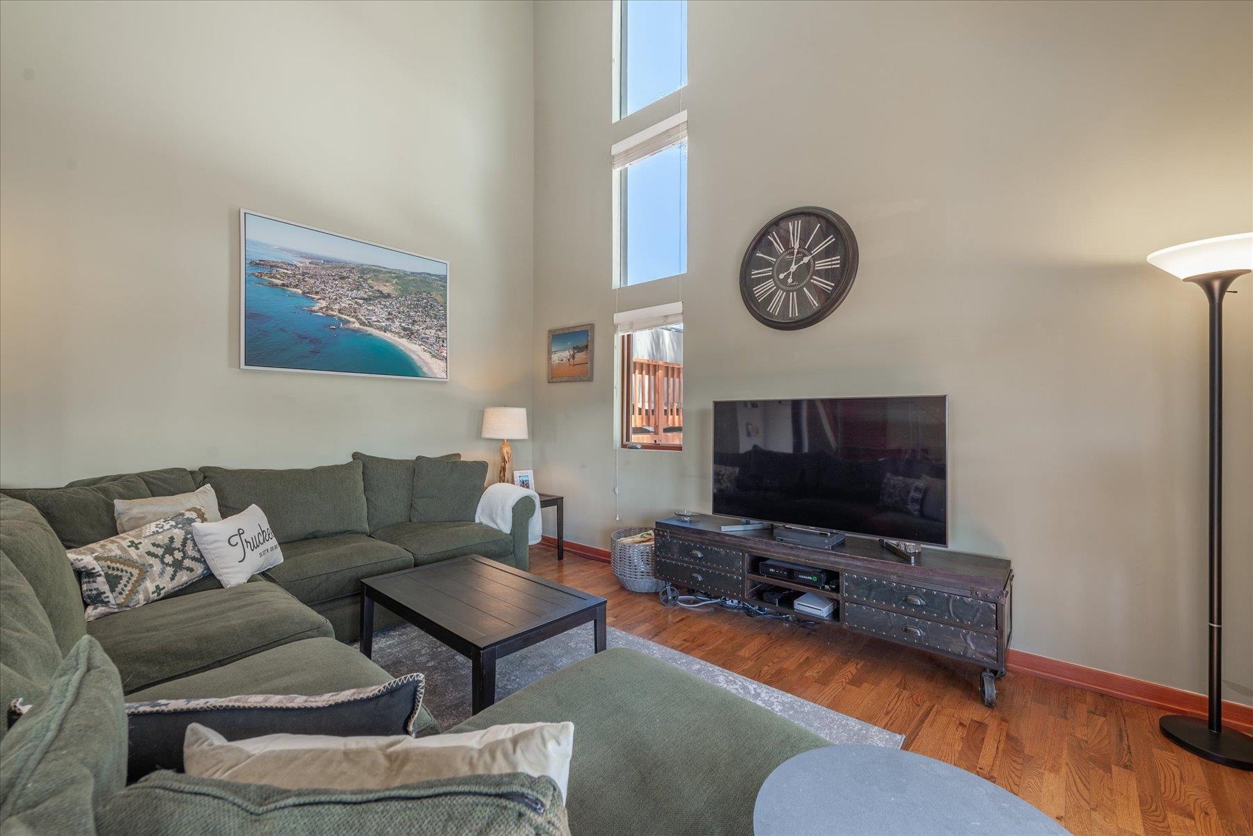 12676 Pinnacle Loop Truckee, CA 96161 - Photo 6 of 19 a living room with furniture a flat screen tv and a wall painting