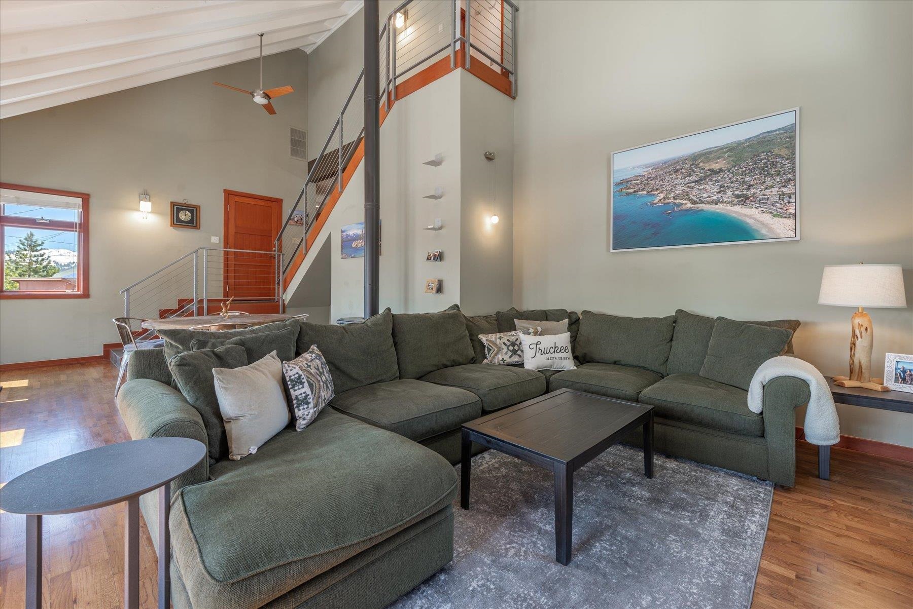 12676 Pinnacle Loop Truckee, CA 96161 - Photo 7 of 19 a living room with furniture and a painting on the wall