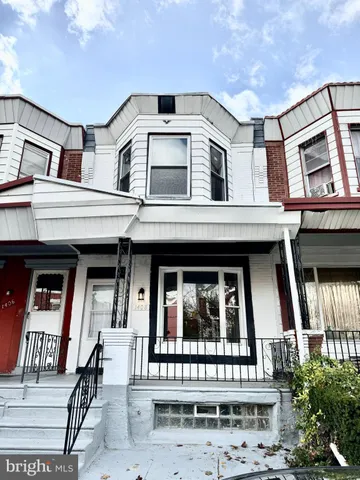 a front view of a house with a porch