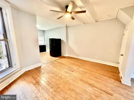 a view of an empty room with a window