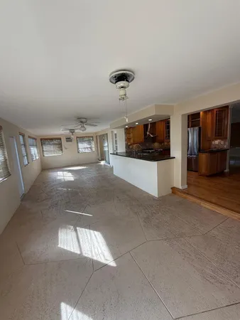 a living room with a couch and a stove top oven