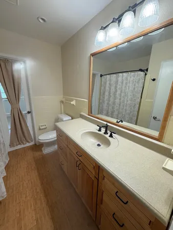a bathroom with a double vanity sink and a mirror