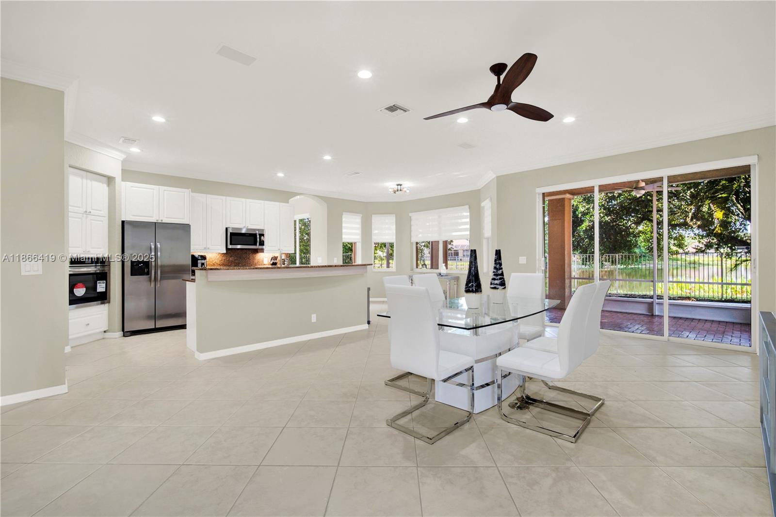 18708 Ocean Mist Drive Boca Raton, FL 33498 - Photo 14 of 58 a living room with furniture and kitchen view