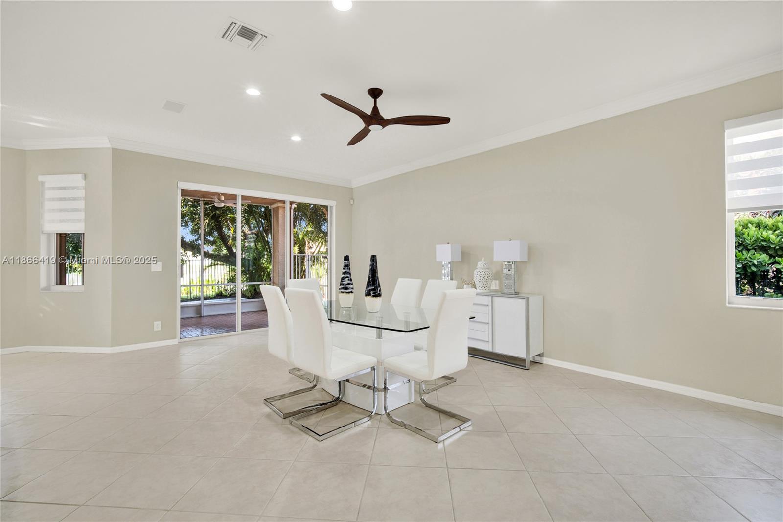 18708 Ocean Mist Drive Boca Raton, FL 33498 - Photo 15 of 58 a living room with furniture a window and ceiling fan