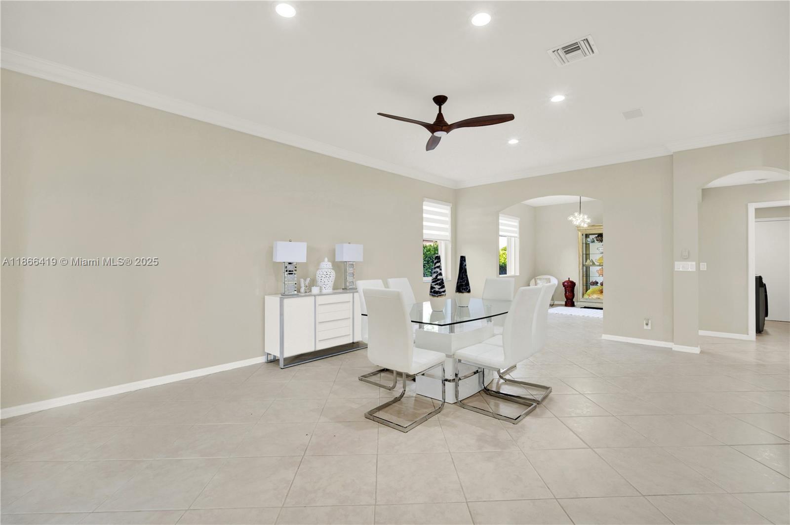 18708 Ocean Mist Drive Boca Raton, FL 33498 - Photo 16 of 58 a living room with furniture and a view of kitchen