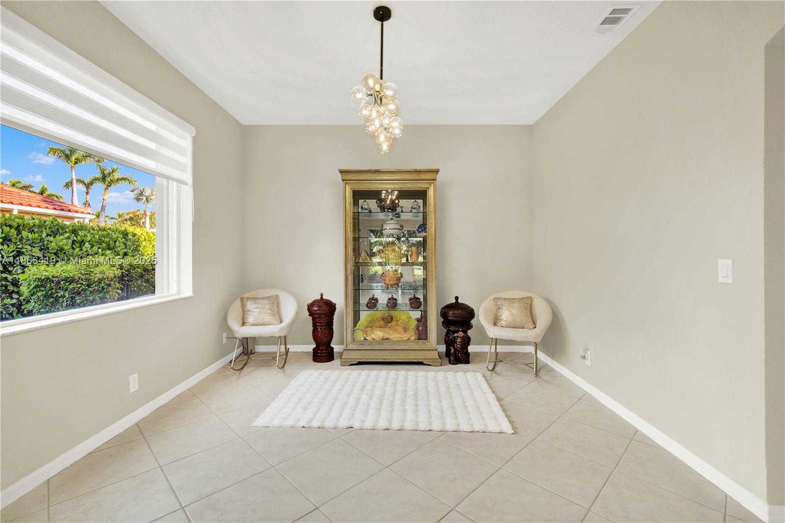 18708 Ocean Mist Drive Boca Raton, FL 33498 - Photo 19 of 58 a bedroom with a bed and a window