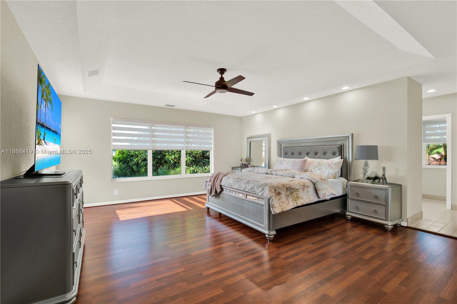 18708 Ocean Mist Drive Boca Raton, FL 33498 - Photo 27 of 58 a bedroom with a bed and a large window
