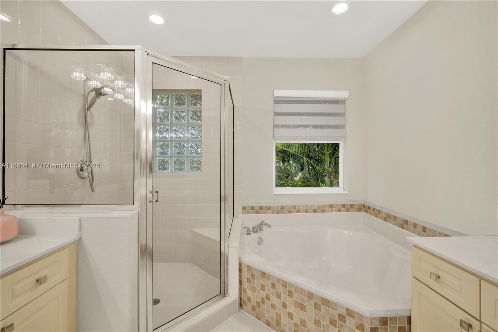 18708 Ocean Mist Drive Boca Raton, FL 33498 - Photo 29 of 58 a bathroom with a granite countertop bathtub shower and sink