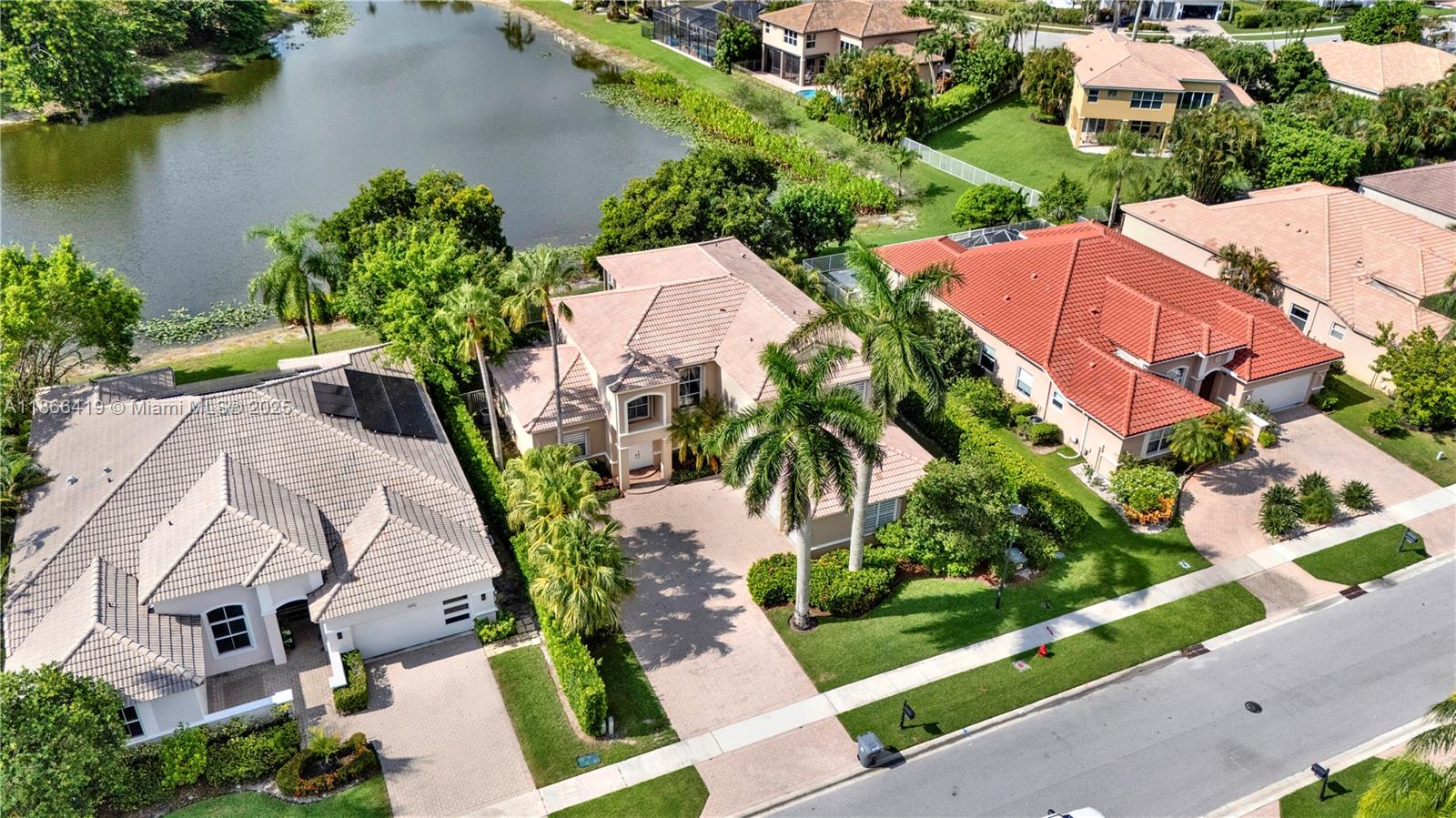 18708 Ocean Mist Drive Boca Raton, FL 33498 - Photo 3 of 58 an aerial view of a house with outdoor space and lake view