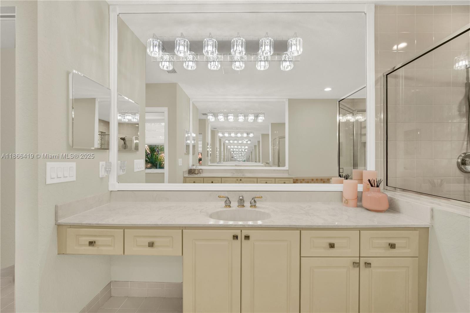 18708 Ocean Mist Drive Boca Raton, FL 33498 - Photo 31 of 58 a bathroom with a sink and a mirror