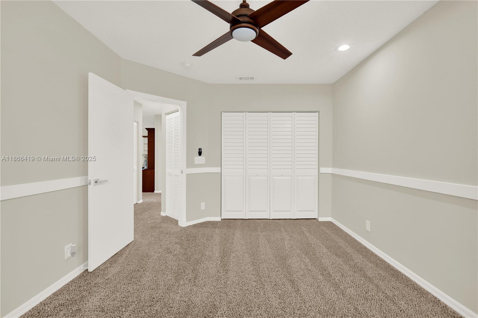 18708 Ocean Mist Drive Boca Raton, FL 33498 - Photo 34 of 58 wooden floor in an empty room with a window