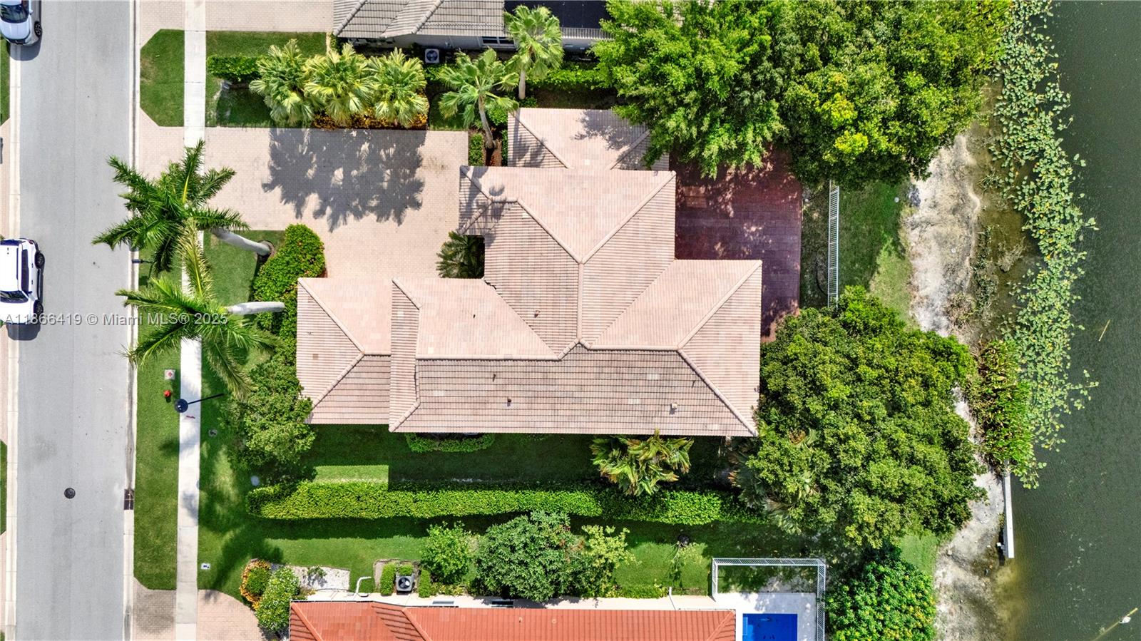 18708 Ocean Mist Drive Boca Raton, FL 33498 - Photo 4 of 58 an aerial view of a house with a yard and garden