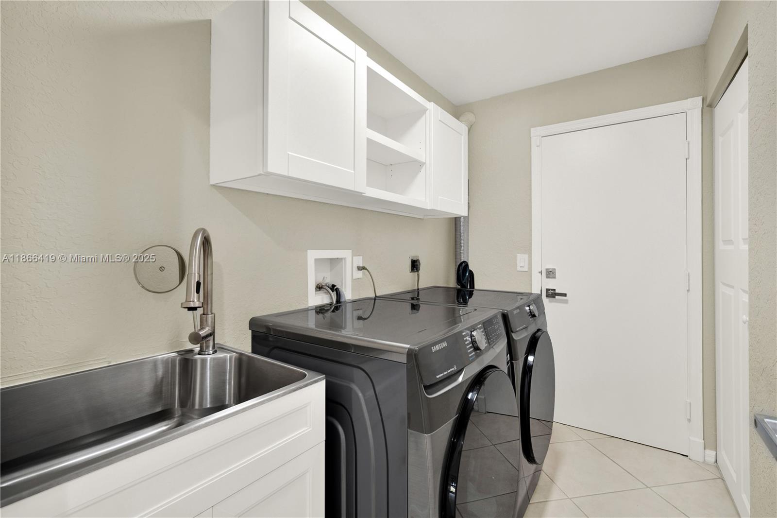 18708 Ocean Mist Drive Boca Raton, FL 33498 - Photo 43 of 58 a view of a sink in a kitchen