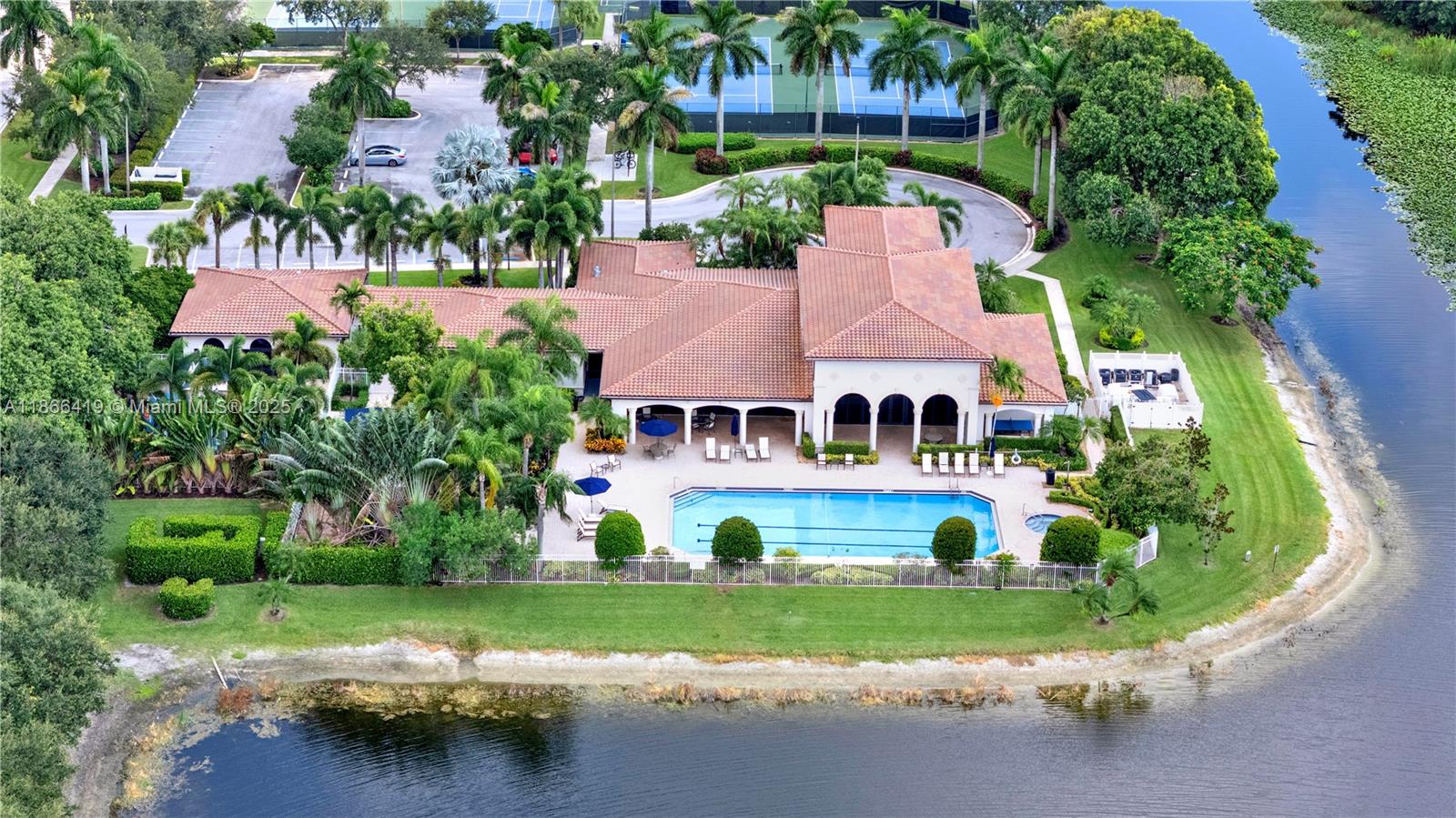 18708 Ocean Mist Drive Boca Raton, FL 33498 - Photo 45 of 58 an aerial view of a house with a garden and lake view
