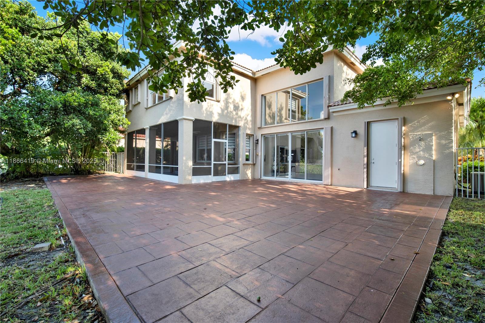 18708 Ocean Mist Drive Boca Raton, FL 33498 - Photo 52 of 58 front view of a house with a tree