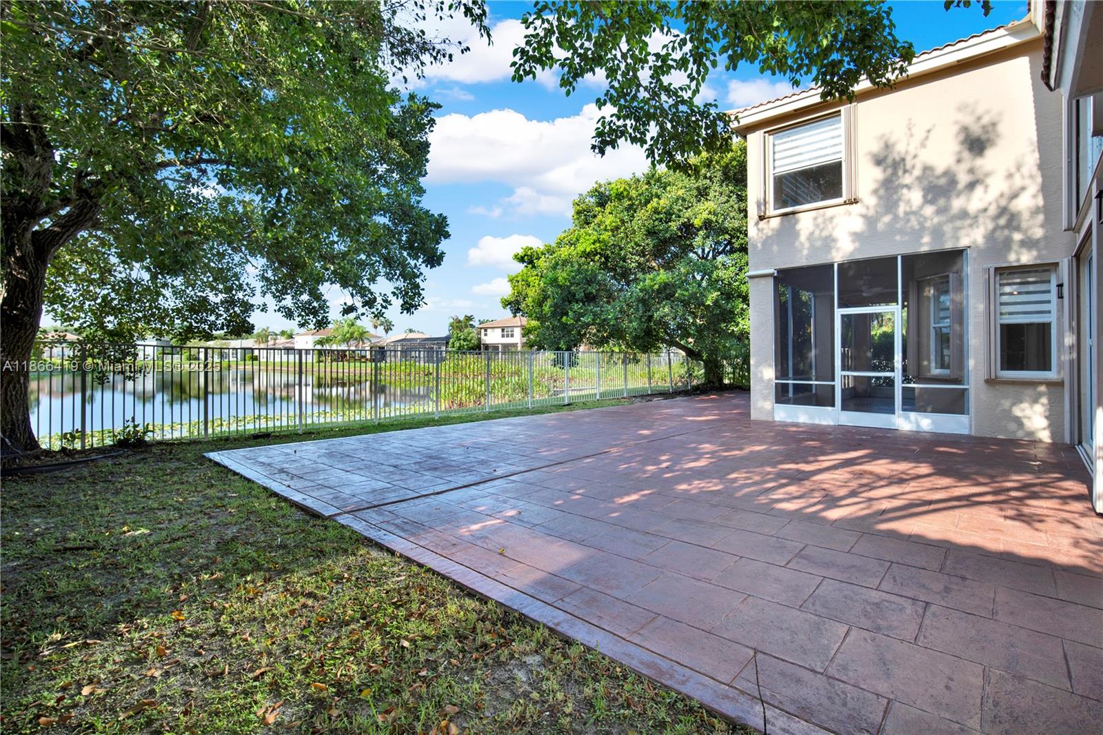 18708 Ocean Mist Drive Boca Raton, FL 33498 - Photo 53 of 58 a view of a backyard with large trees